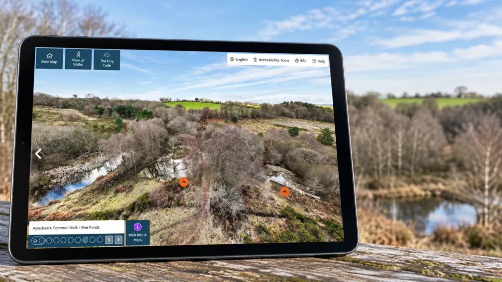 Tablet showing the Pebblebed Heaths virtual tour at Five Ponds.